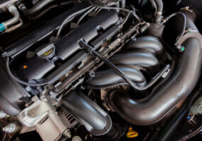 New car engine. Car hood open. Automotive industry.